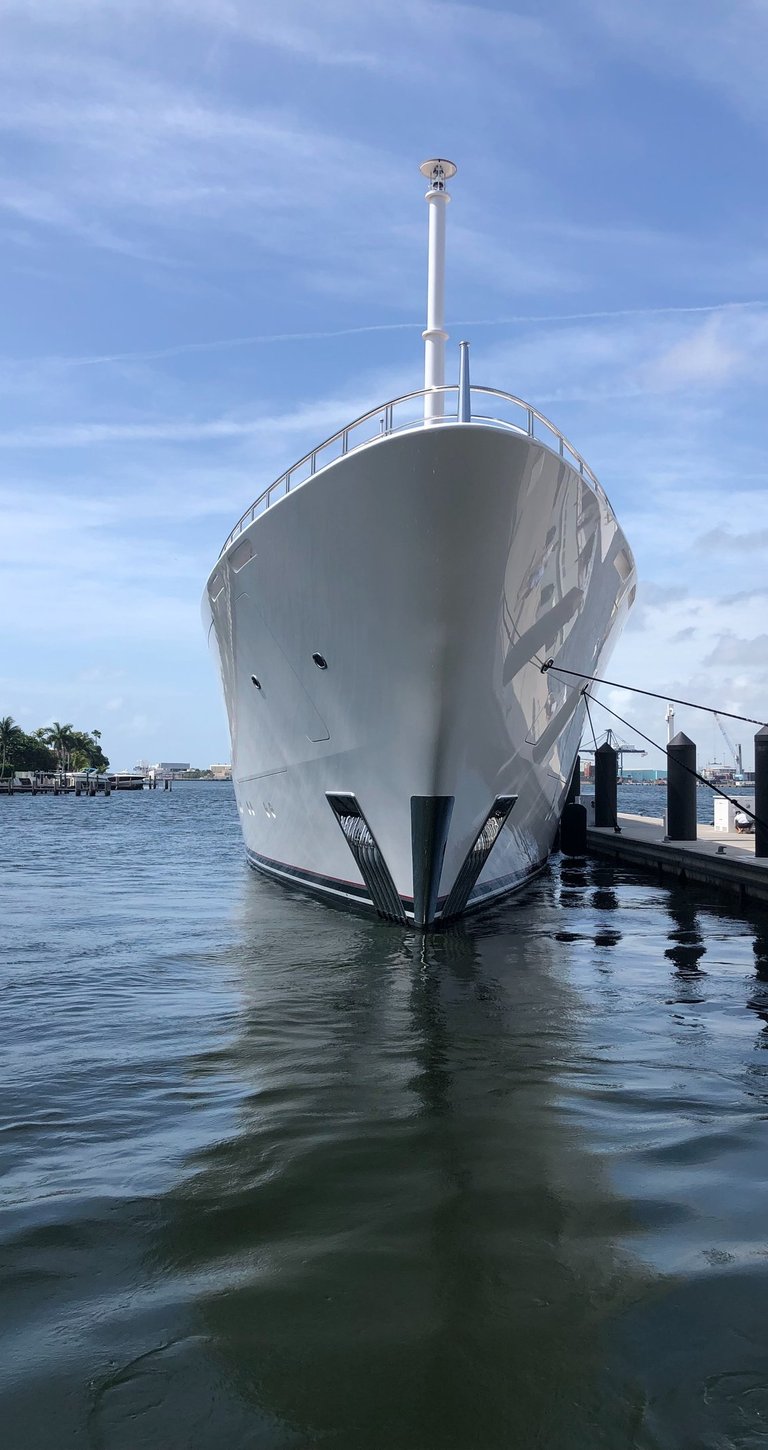 a large white yacht docked at our dock