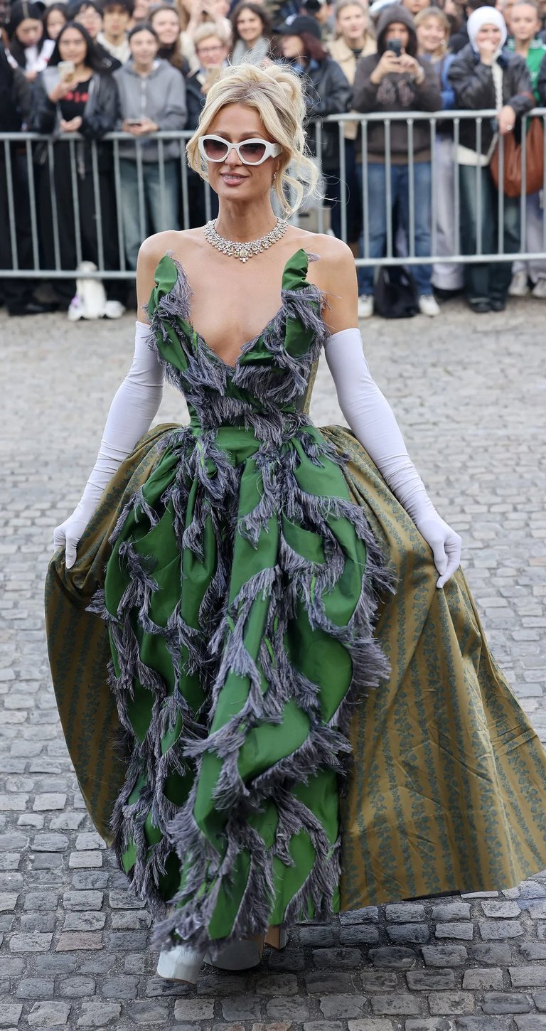 Paris Hilton at Paris Fashion Week 2026 in green gown.