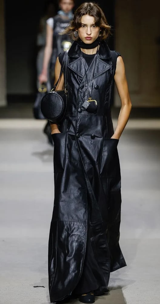 Black leather maxi coat dress with bold accessories at Coach Spring/Summer 2026 show.