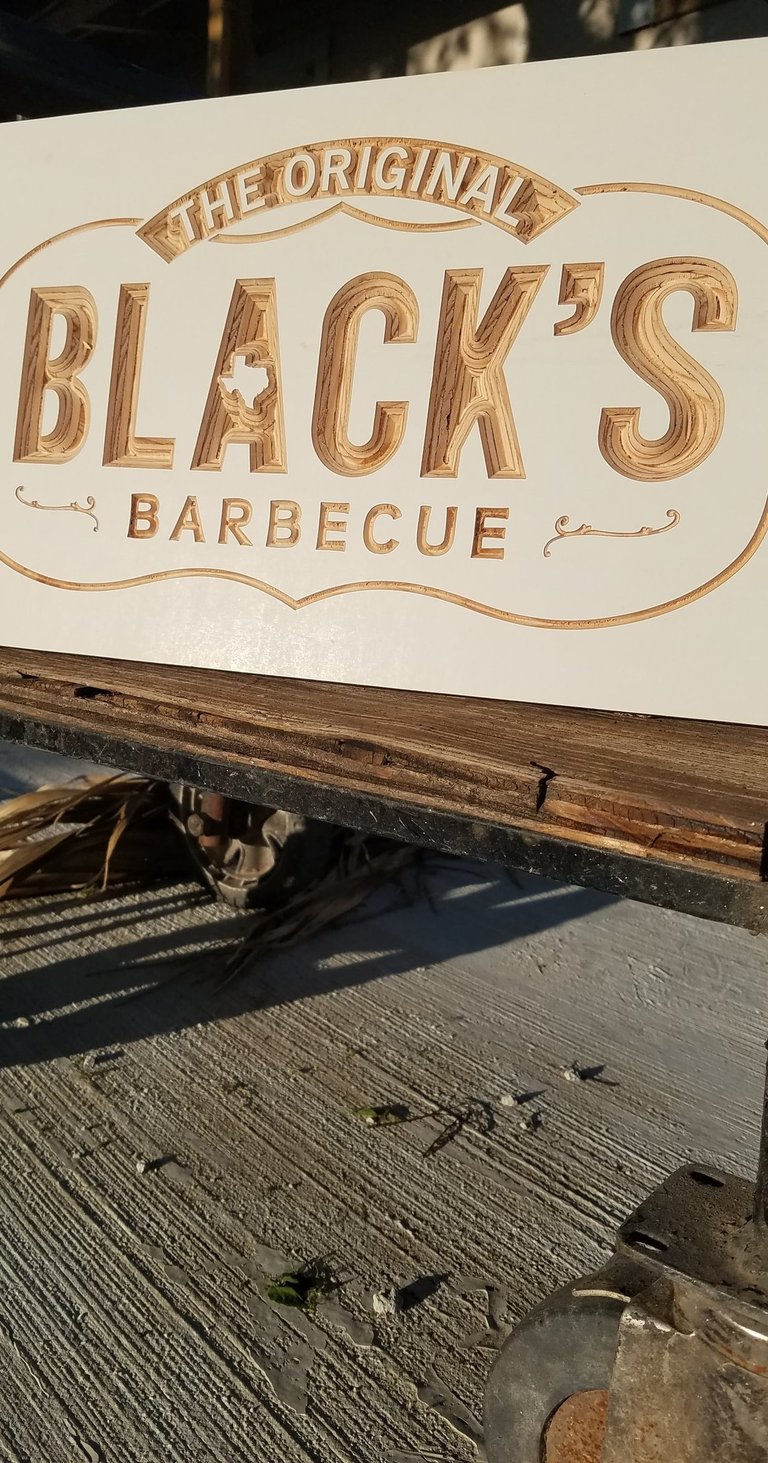 a custom made wooden sign that says black's barbequequee