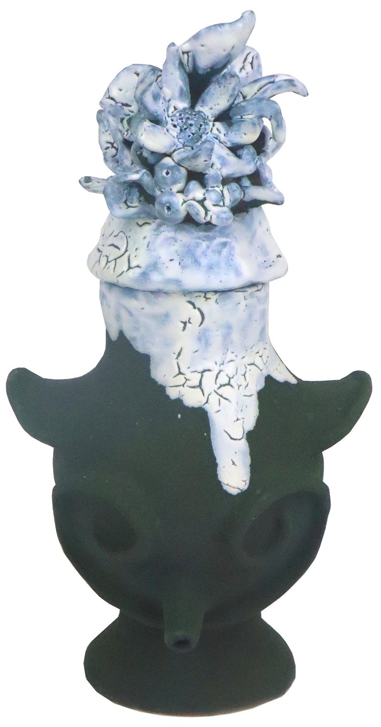 a vase with a flower on it