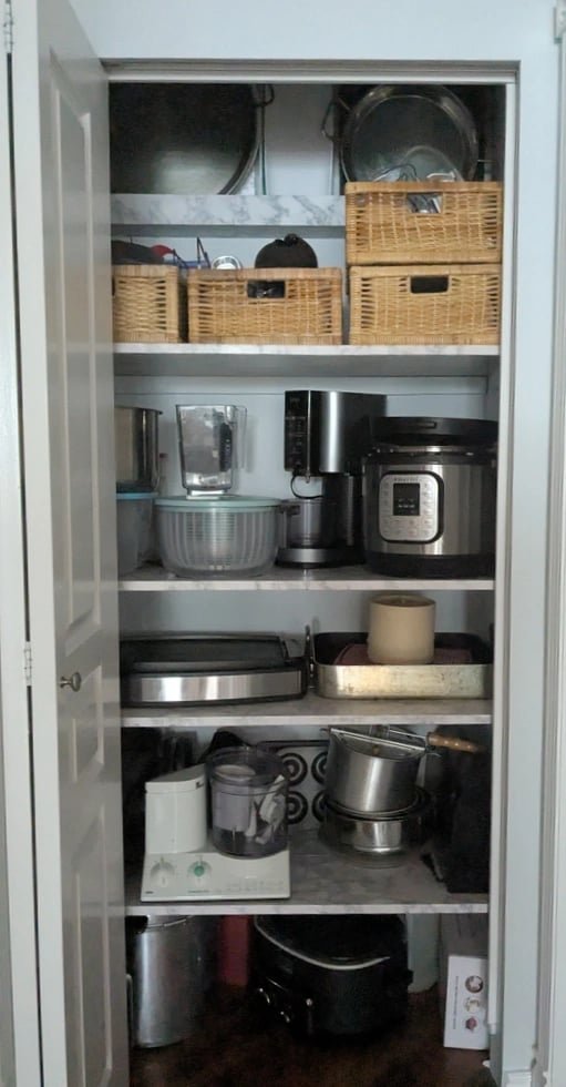 New kitchenware shelving, filld neatly with heavy appliances