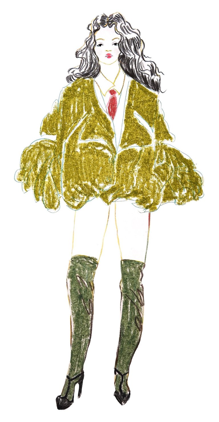 a fashion woman in a green coat and boots