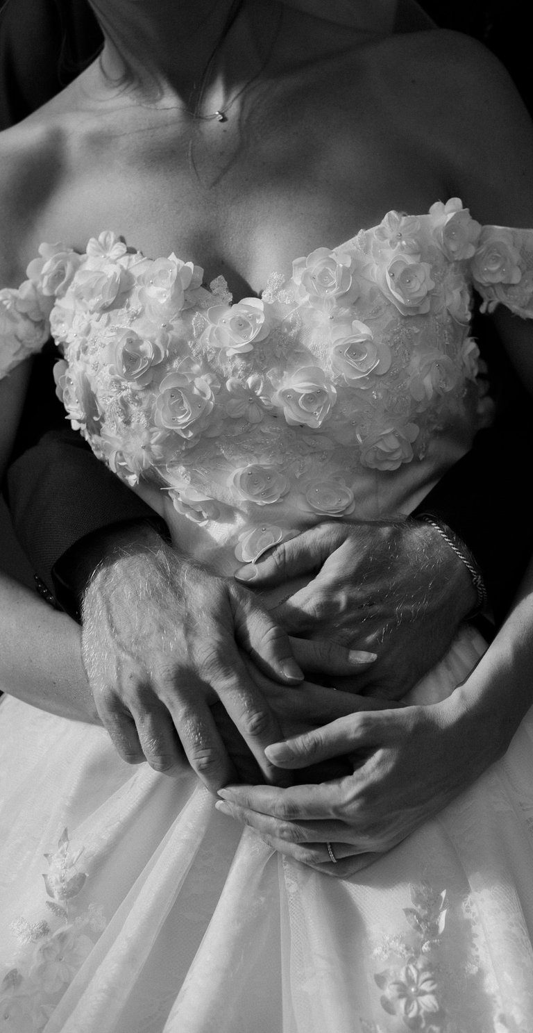 a bride and grooms hands on their wedding day