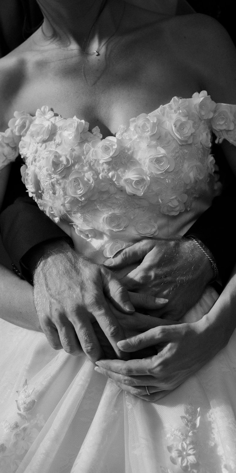a bride and grooms hands on their wedding day