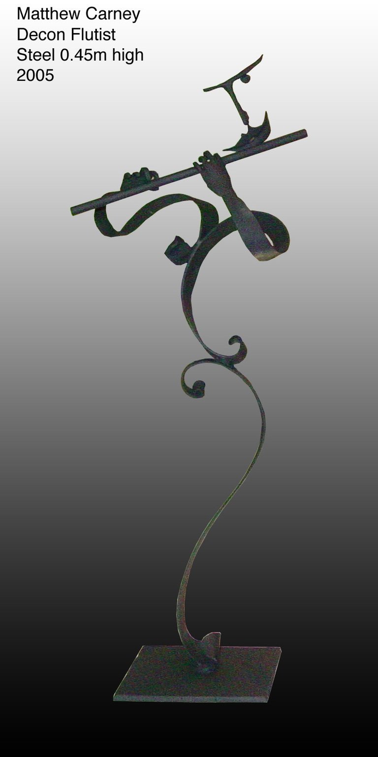 a sculpture of a person playing the flute