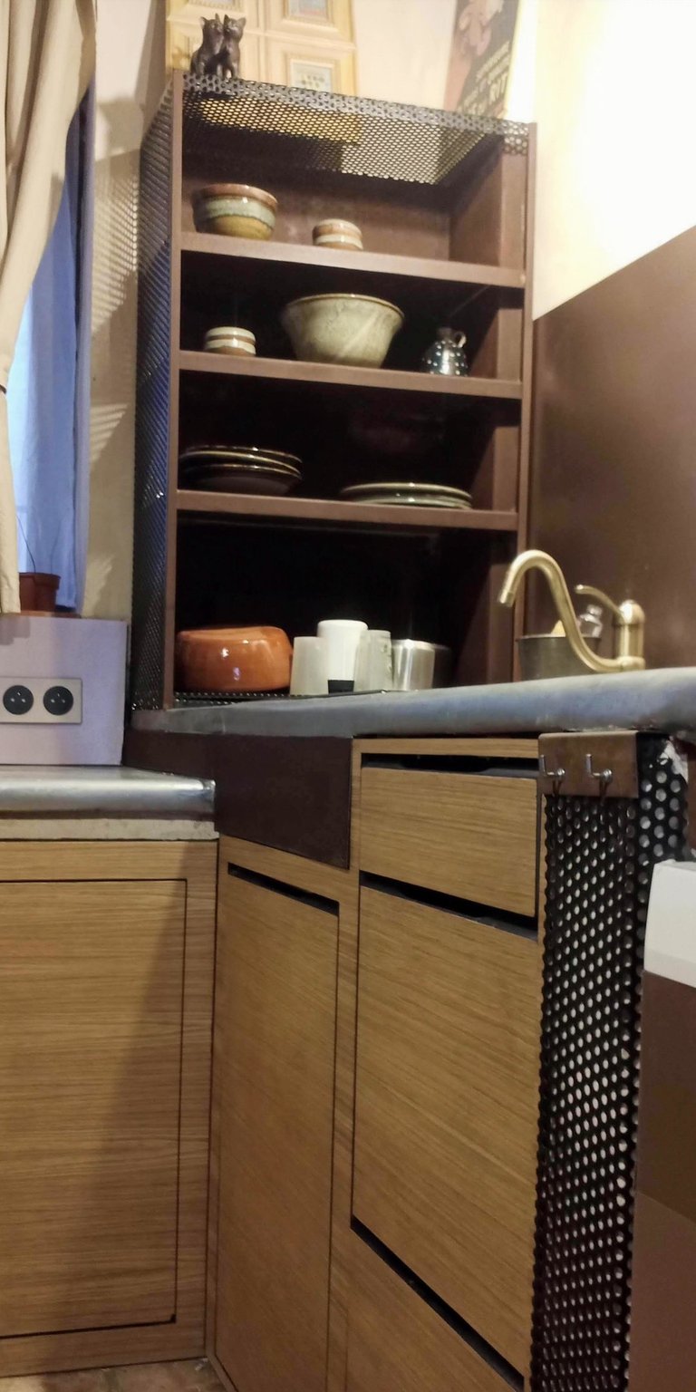 a kitchen in oak and steel furniture