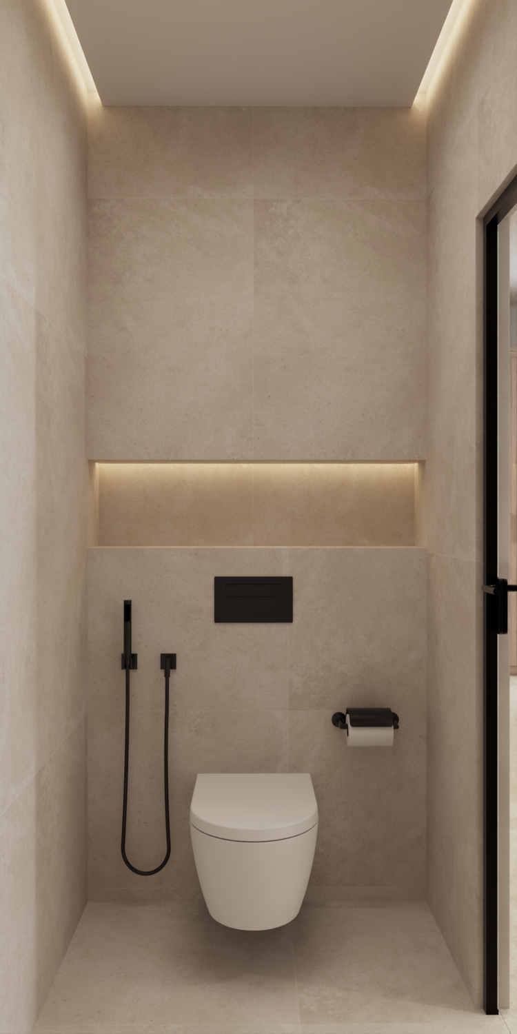 Wall-mounted toilet, bidet, and toilet paper holder in a beige bathroom.