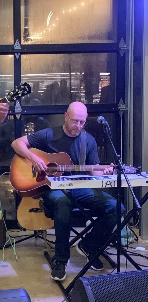 William Finn from Finn's Echo performing in front of live audience