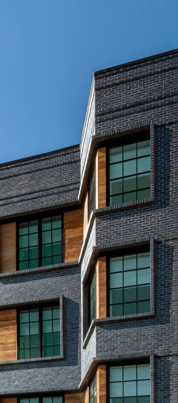 An architectural photo of a brick building with an angle