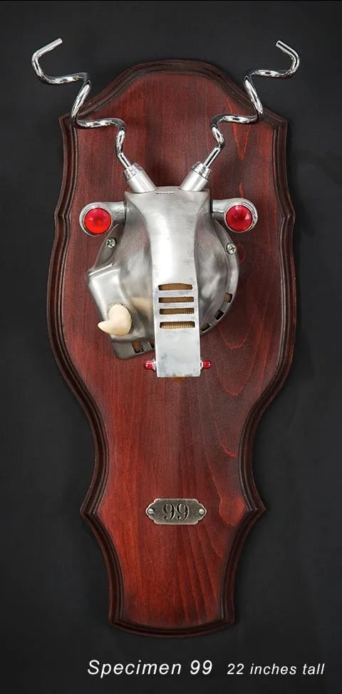 Mounted metal animal head named Specimen 99 created by artist Tal Avitzur.