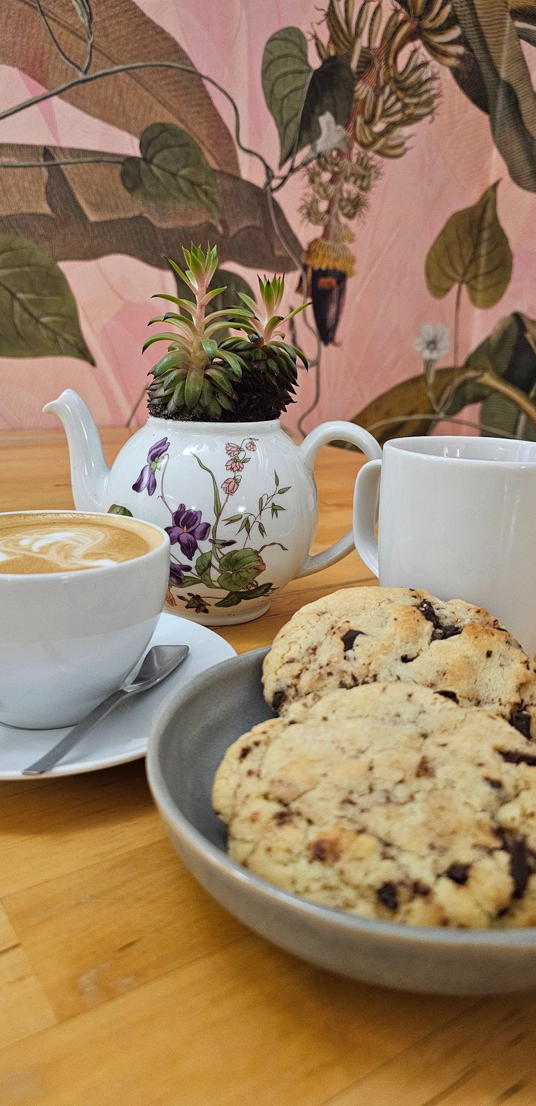 Dark chocolate and white chocolate cookie with a coffee cup