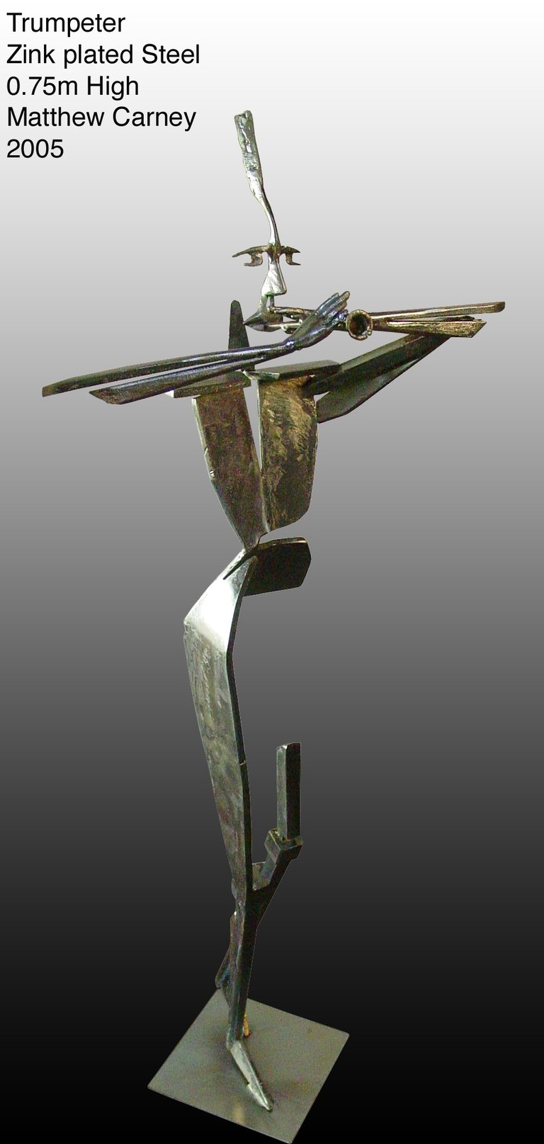 a sculpture of a man playing a trumpet