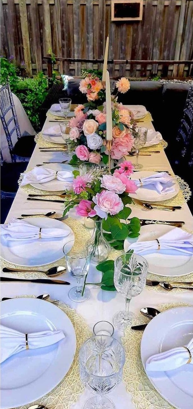 Backyard table setting for 20 guests, centerpieces , candles, tableware