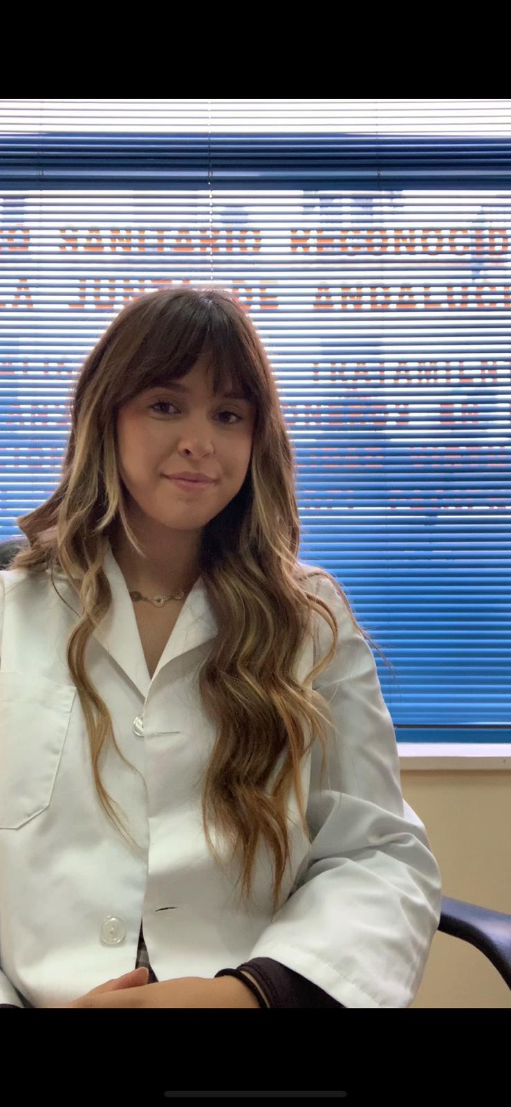 a woman in a white lab coat and a white lab coat