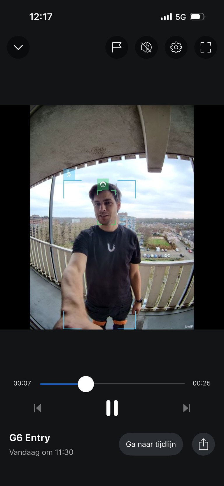 A person captured by a UniFi video doorbell security camera on a balcony with face detection framing.