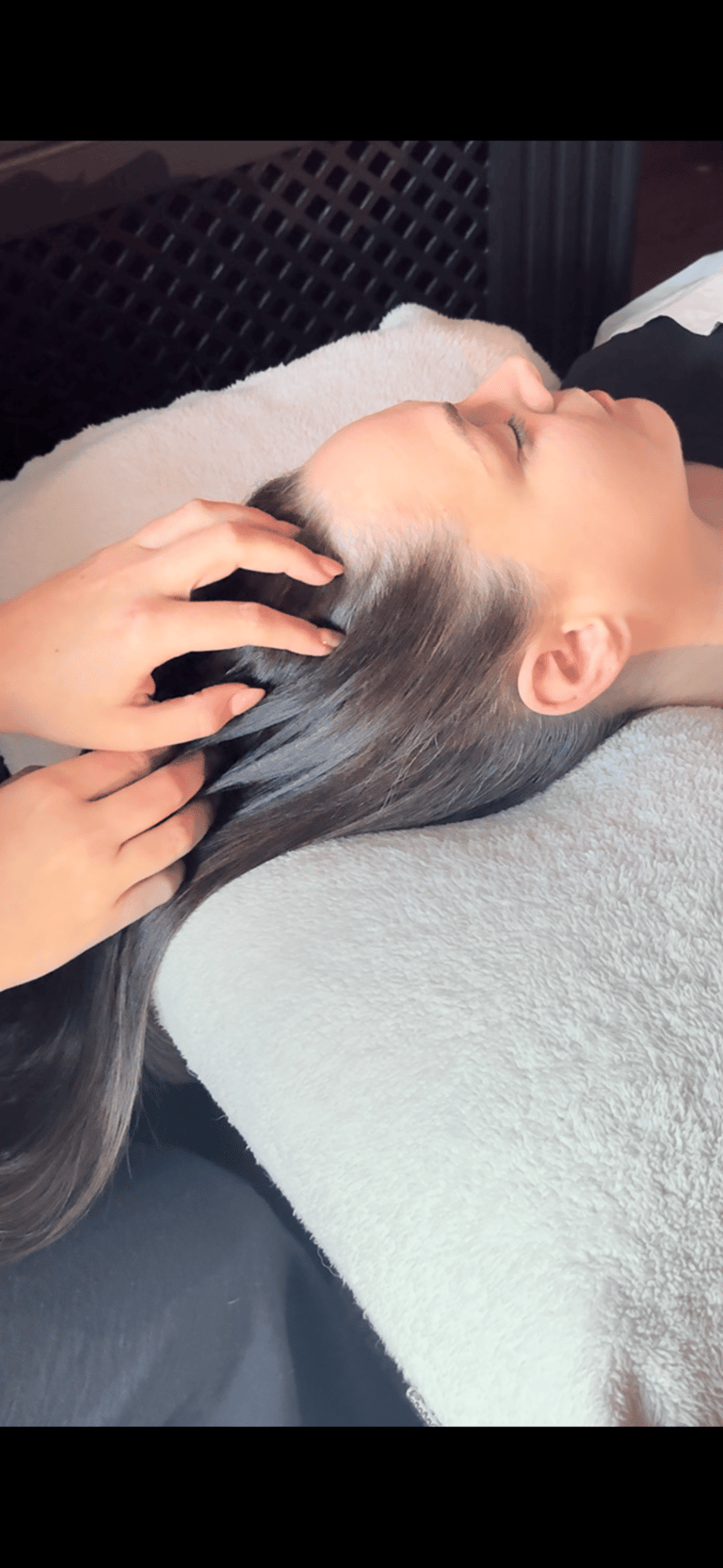 woman having hair stroked