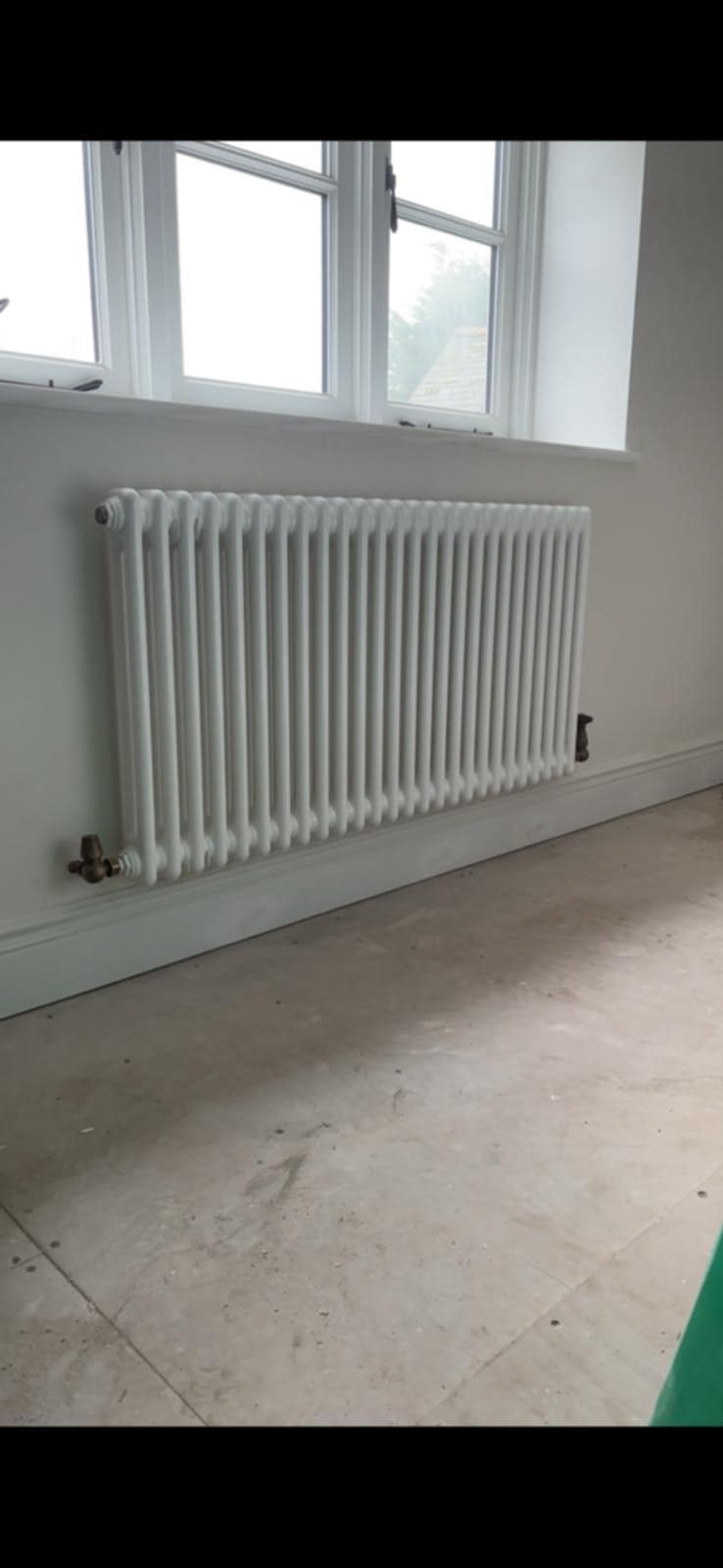 Heated towel rail fitting in Pershore bathroom by PBP Services heating specialists