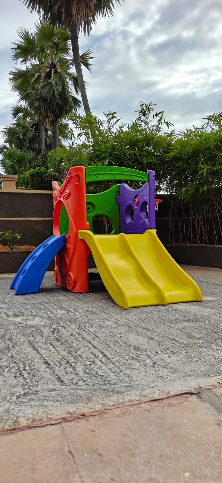 Colorful plastic toddler slide and backyard playground set for outdoor kids play.