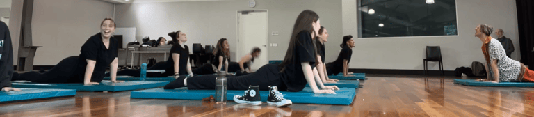 a group of people doing yoga exercises on their own mats