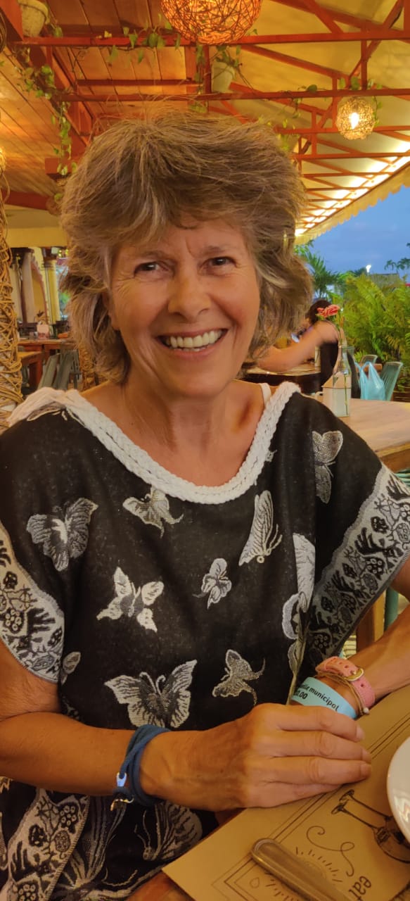 Sara Verrall smiling in Black and White butterfly dress