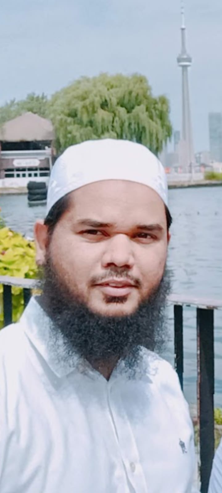 Photo of Dr. Kaleem at Toronto Islands, CN tower could be noticed in the background.