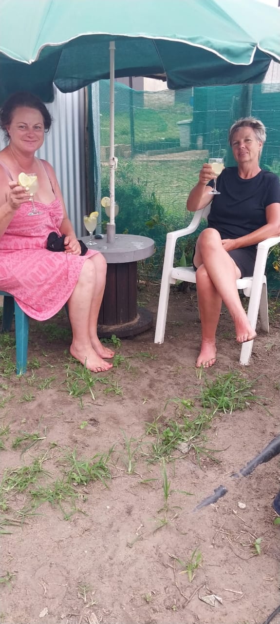 Two lady clients having a post massage drink