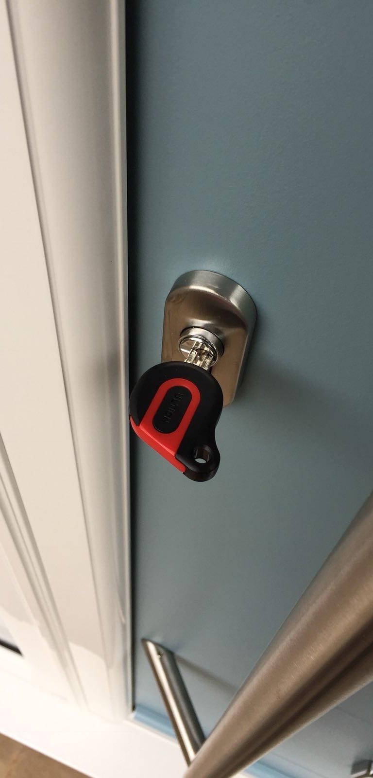 an ultion key on a new duck egg blue composite door