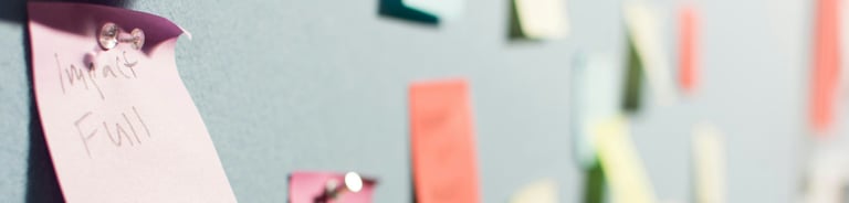 a wall with notes on it and a bunch of notes on it