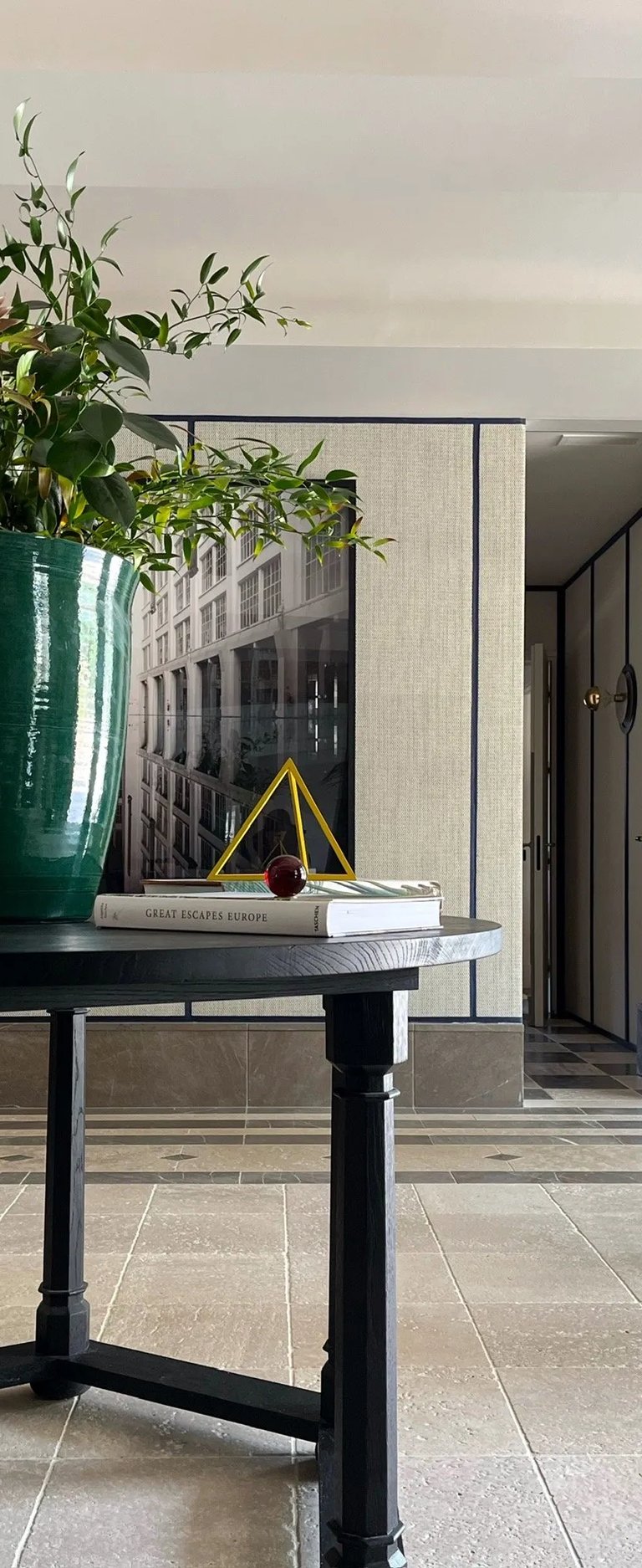 Entrance foyer at Villa La Gratitud with sculptural console and fresh florals