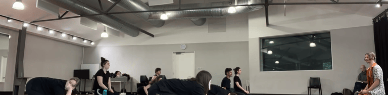 a group of people in a gym room