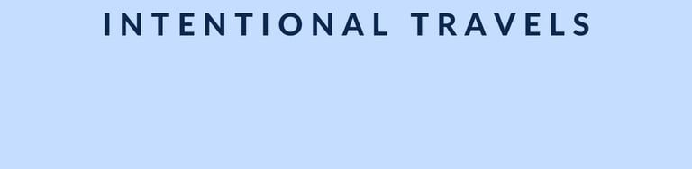 Minimalistic blog banner for 'Intentional Travels' with bold green text on a light blue background, 