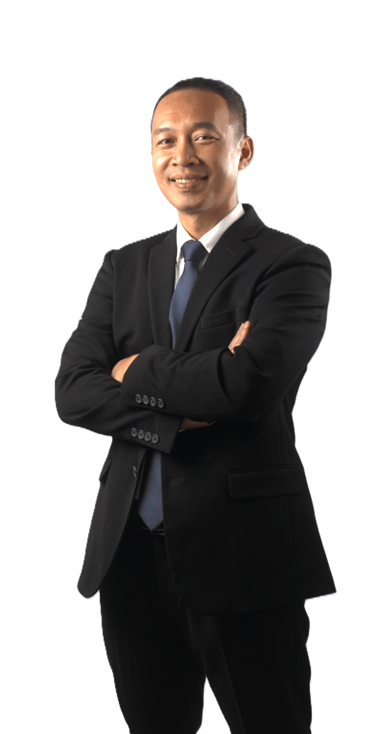 Smiling Asian businessman in a formal black suit and blue tie with arms crossed.