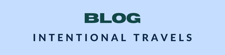 Minimalistic blog banner for 'Intentional Travels' with bold green text on a light blue background, 