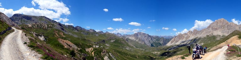 a group of people riding bikes down a mountain