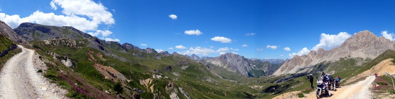 a group of people riding bikes down a mountain