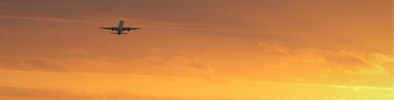Airliner, airplane takeoff at sunset or sunrise