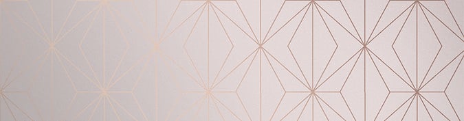 Elegant room with rose gold geometric wallpaper, modern accent chair, and luxury home decor accents.