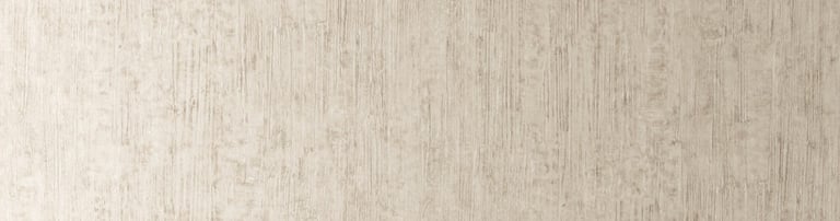 Minimalist home office with textured beige wallpaper, a wooden desk, white ceramic vase, and open book.