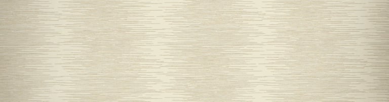 Elegant cream textured wallpaper behind a modern console table with white orchids and gold candle holders.