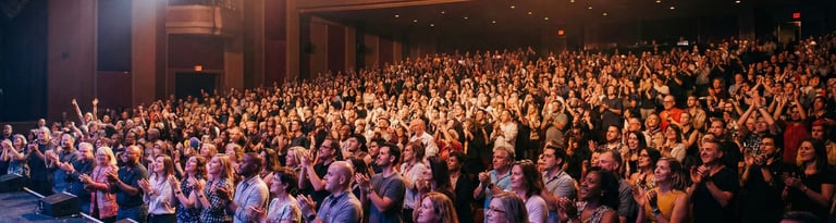 a man standing in front of a crowd of people