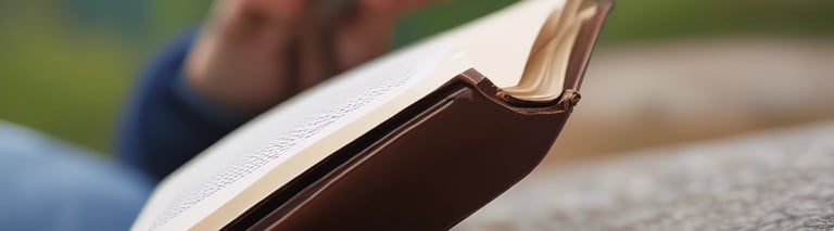 Person sitting with an open journal contemplating life