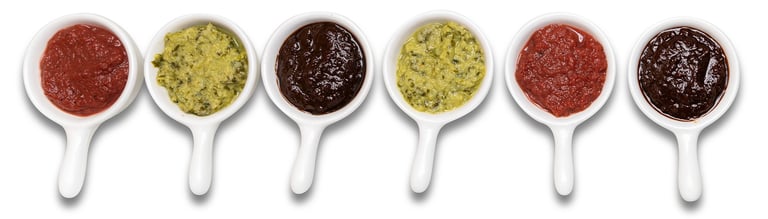Sustainable plant-based sauces displayed in small white dishes