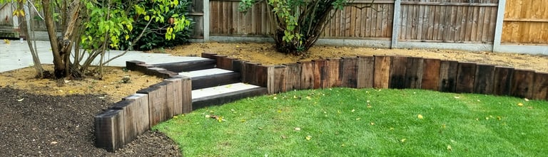 800m2 Full Garden Remodel Curved Sleeper Retaining Wall Planters, Lawn & Split-face Tiled Wall Step