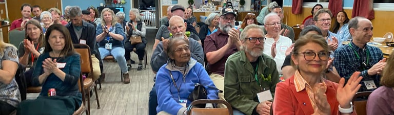 Audience applauding after a talk at a chapter meeting