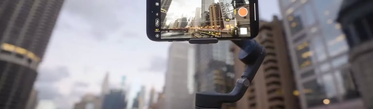 iPhone 14 Pro mounted on a stabilizer, recording cinematic video in an urban setting.