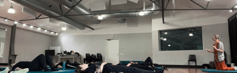 a group of people in a gym room
