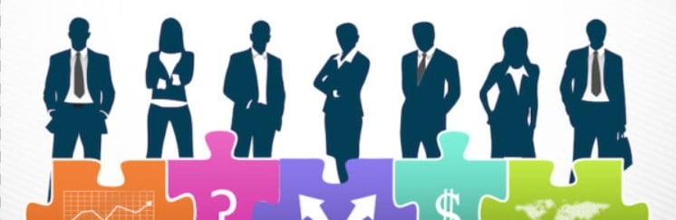 business people standing in front of a puzzle piece of puzzle pieces