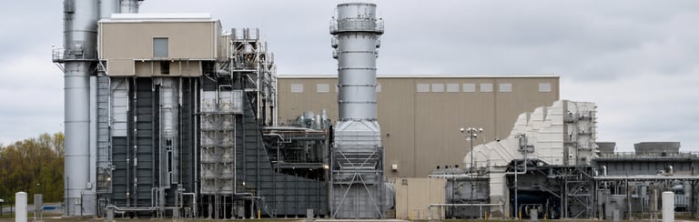 Power generation facility with gas turbine and critical plant systems under engineering investigatio