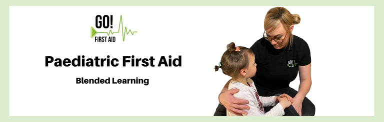 First aider comforting a young chid with an arm around their shoulder